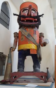 giant wooden toy soldier with long nose