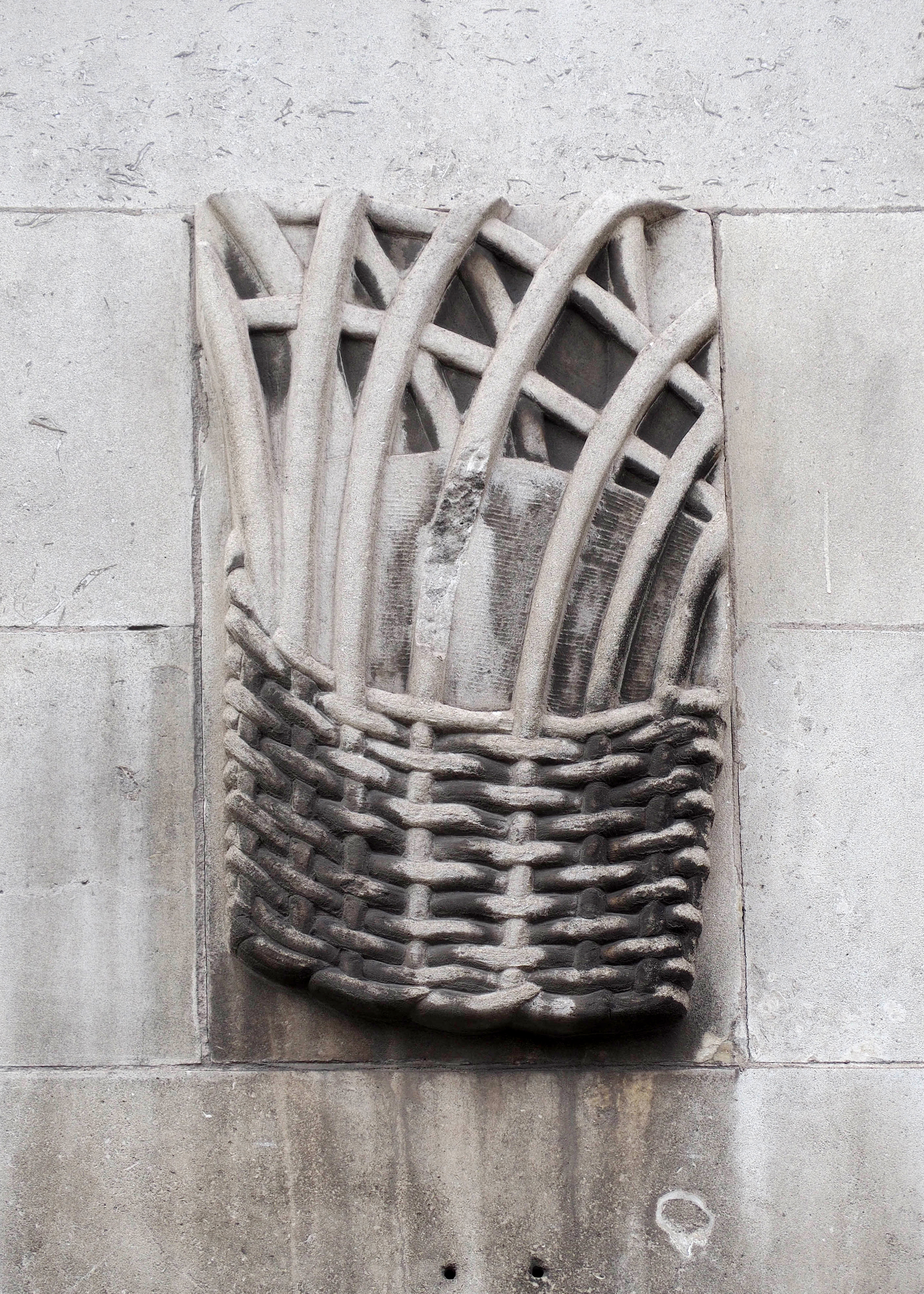 Relief from the Royal School for the Blind in Liverpool showing a woven basket.
