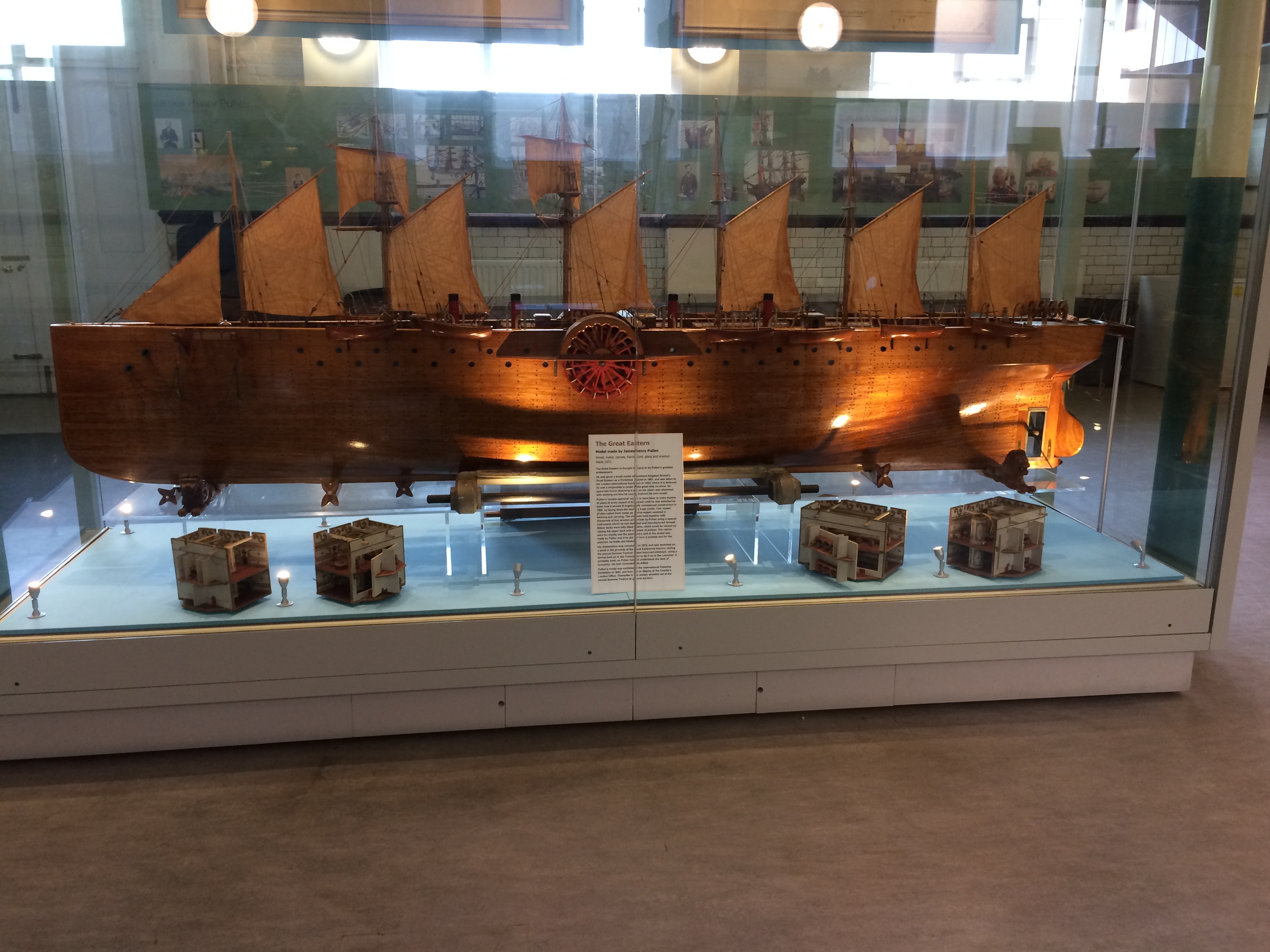 Wooden model boat with many sails