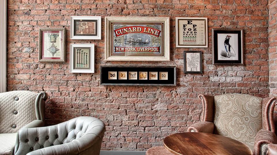 Exposed brick wall with memorabilia from the Old Blind School