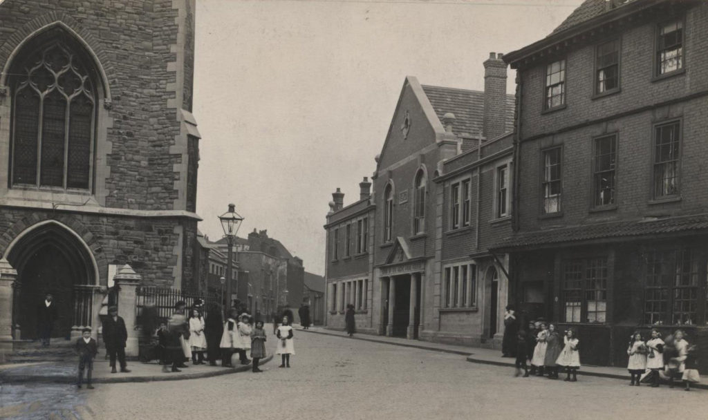 Bristol street - no sign of traffic, but many young children standing about on the pavements.
