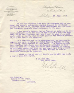 Image shows headed notepaper with a curving script, typed on in purple ink