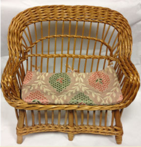 wicker sofa with patterned cushion