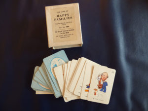 Card game with a picture of a tailor face up